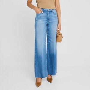 PAIGE "Anessa" jeans featuring a raw hem in faded medium-wash denim